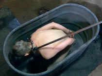 Slave in the cage humiliated